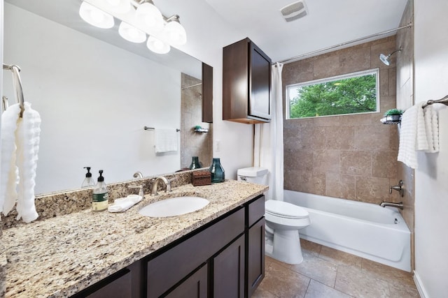 3407 Banton Rd Unit A, Austin, TX 78722 - full bath with vanity, toilet, shower / bath combination, and stone finish floors
