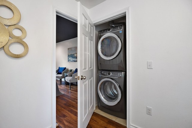 3407 Banton Rd Unit A, Austin, TX 78722 - laundry area featuring stacked washer and clothes dryer and dark wood-type flooring