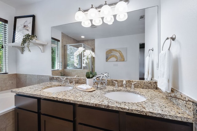 3407 Banton Rd Unit A, Austin, TX 78722 - full bathroom featuring double vanity, a stall shower, a bath, and a chandelier