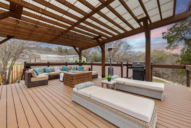 119 Vicinity Trl, Spicewood, TX 78669 - deck at dusk featuring an outdoor living space, a pergola, and area for grilling