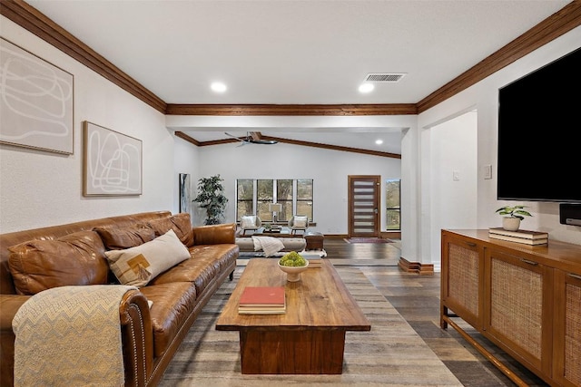 119 Vicinity Trl, Spicewood, TX 78669 - living room with vaulted ceiling, crown molding, baseboards, dark wood-style flooring, and a ceiling fan