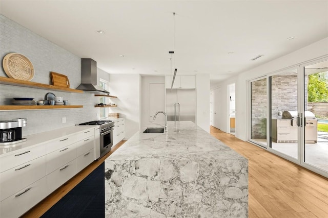 4005 Knollwood Dr, Austin, TX 78731 - kitchen featuring wall chimney range hood, premium appliances, modern cabinets, open shelves, and backsplash