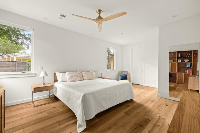 4005 Knollwood Dr, Austin, TX 78731 - bedroom with light wood-style floors and a ceiling fan