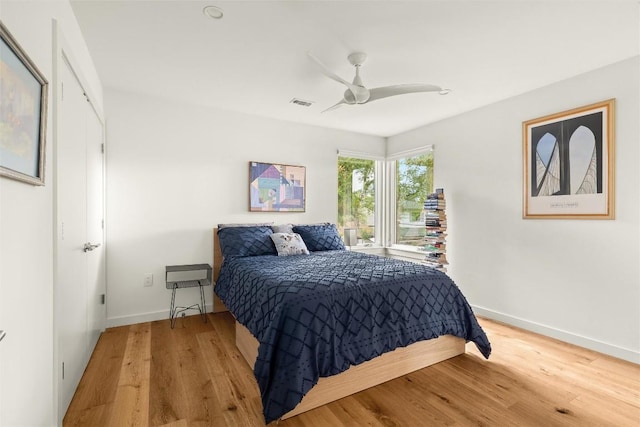 4005 Knollwood Dr, Austin, TX 78731 - bedroom with light wood finished floors and a ceiling fan