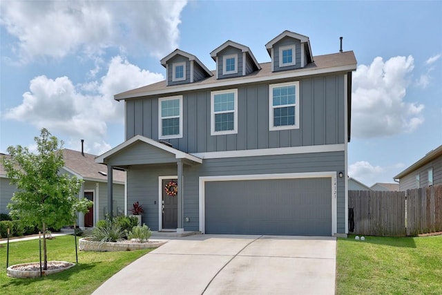 14121 Sandrock Bnd, Pflugerville, TX 78660 - view of front of house featuring board and batten siding, driveway, and a garage