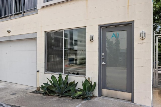 4801 S Congress Ave Unit A1, Austin, TX 78745 - doorway to property featuring concrete block siding and a garage