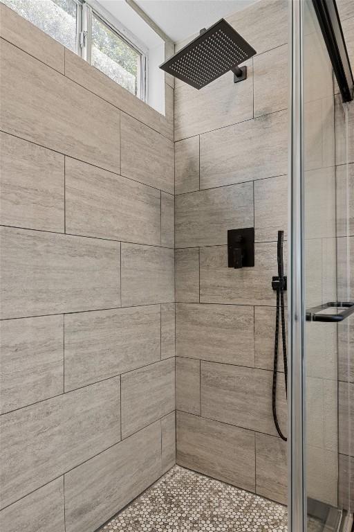 4801 S Congress Ave Unit A1, Austin, TX 78745 - full bathroom featuring a stall shower