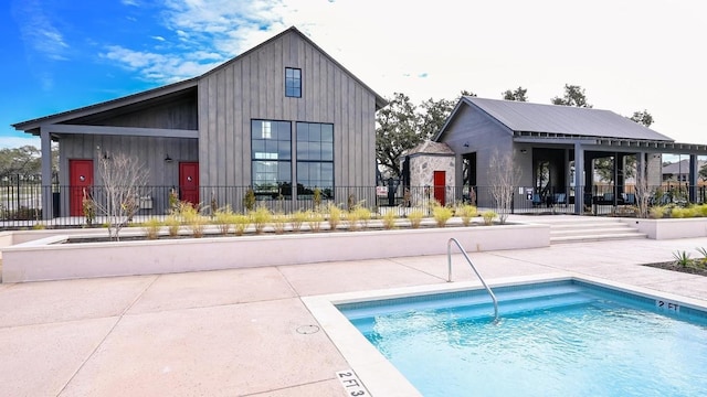 164 Coyote Creek Pass, Kyle, TX 78640 - community pool featuring a patio