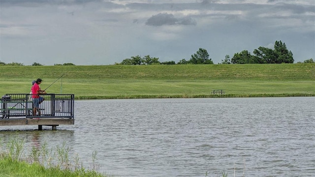 164 Coyote Creek Pass, Kyle, TX 78640 - dock area with a water view and a lawn