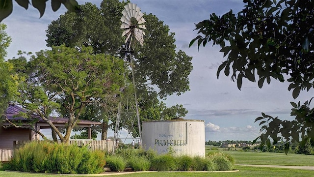 164 Coyote Creek Pass, Kyle, TX 78640 - community sign featuring a yard