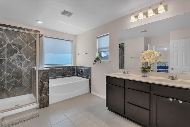351 Jarbridge Dr, Kyle, TX 78640 - full bath with tile patterned floors, a garden tub, double vanity, and a shower stall