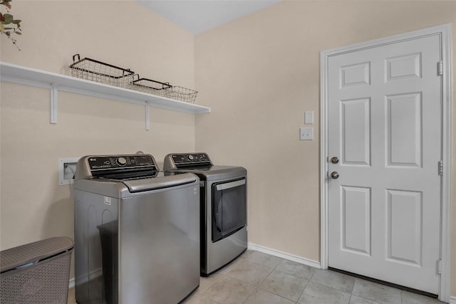 351 Jarbridge Dr, Kyle, TX 78640 - laundry room with separate washer and dryer and light tile patterned floors