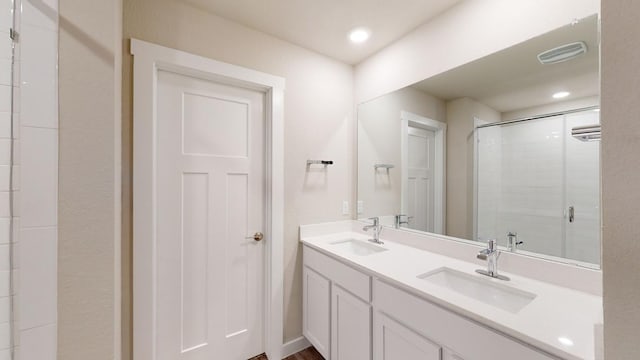 4019 Illian Cv, Killeen, TX 76542 - bathroom featuring double vanity, a stall shower, and recessed lighting