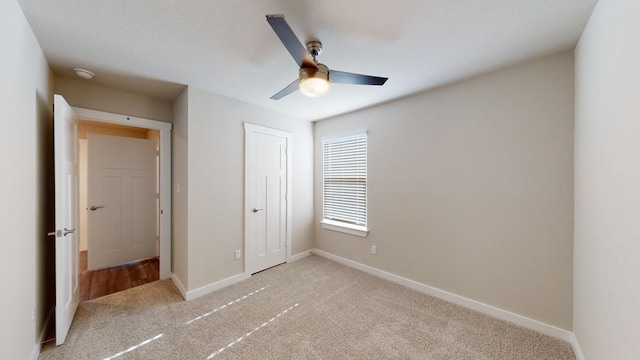 4019 Illian Cv, Killeen, TX 76542 - unfurnished bedroom featuring light carpet, baseboards, a closet, and ceiling fan