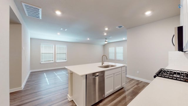 4019 Illian Cv, Killeen, TX 76542 - kitchen featuring dishwasher, a sink, wood finished floors, open floor plan, and recessed lighting
