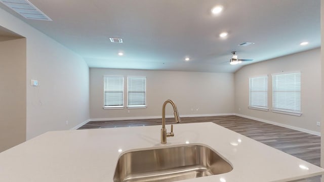 4019 Illian Cv, Killeen, TX 76542 - kitchen featuring a sink, open floor plan, recessed lighting, wood finished floors, and light countertops
