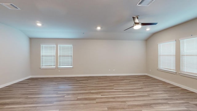4019 Illian Cv, Killeen, TX 76542 - empty room with healthy amount of natural light, ceiling fan, lofted ceiling, recessed lighting, and light wood-style floors