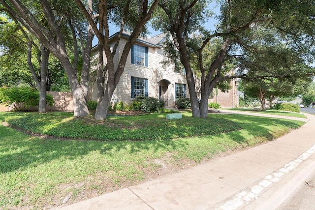8006 Monona Ave, Austin, TX 78717 - view of front of property featuring stone siding and a front lawn