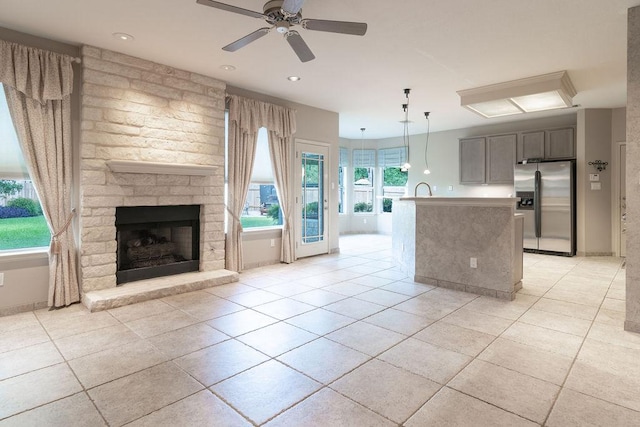 8006 Monona Ave, Austin, TX 78717 - kitchen featuring stainless steel fridge, open floor plan, light tile patterned floors, a ceiling fan, and recessed lighting