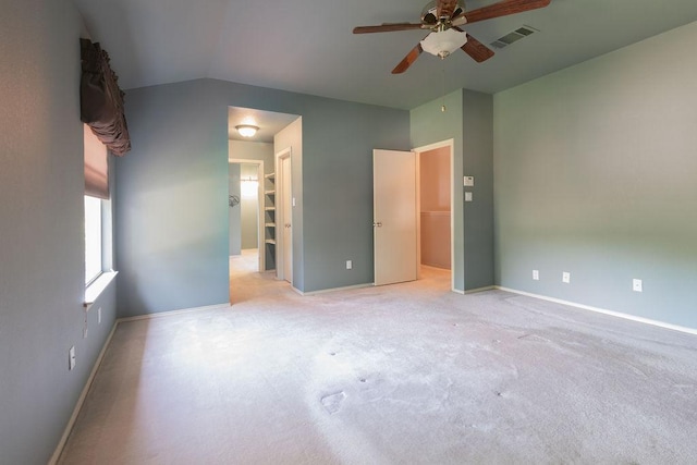 8006 Monona Ave, Austin, TX 78717 - unfurnished bedroom featuring light carpet, baseboards, vaulted ceiling, a spacious closet, and ceiling fan