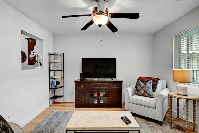 1307 Norwalk Ln Unit 104, Austin, TX 78703 - living room with light wood finished floors, a ceiling fan, and baseboards