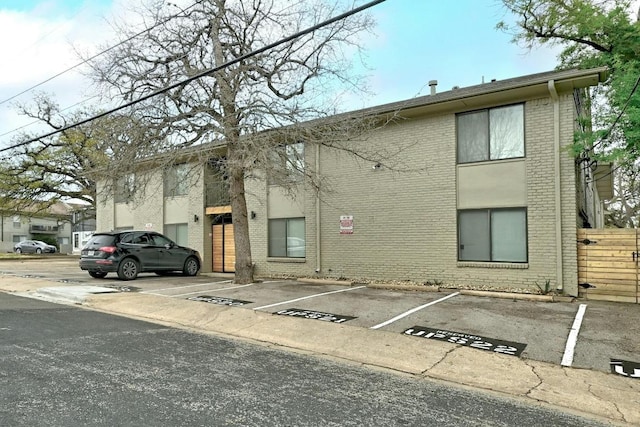 1307 Norwalk Ln Unit 104, Austin, TX 78703 - view of building exterior featuring uncovered parking