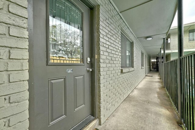 1307 Norwalk Ln Unit 104, Austin, TX 78703 - view of exterior entry with brick siding