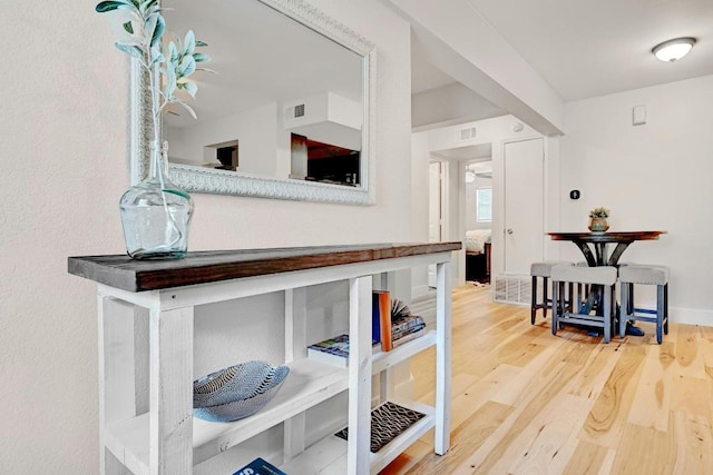 1307 Norwalk Ln Unit 104, Austin, TX 78703 - corridor featuring wood finished floors and baseboards