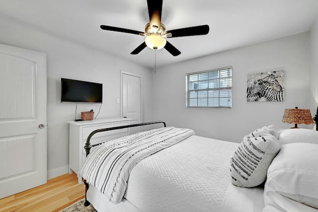 1307 Norwalk Ln Unit 104, Austin, TX 78703 - bedroom with light wood finished floors and a ceiling fan