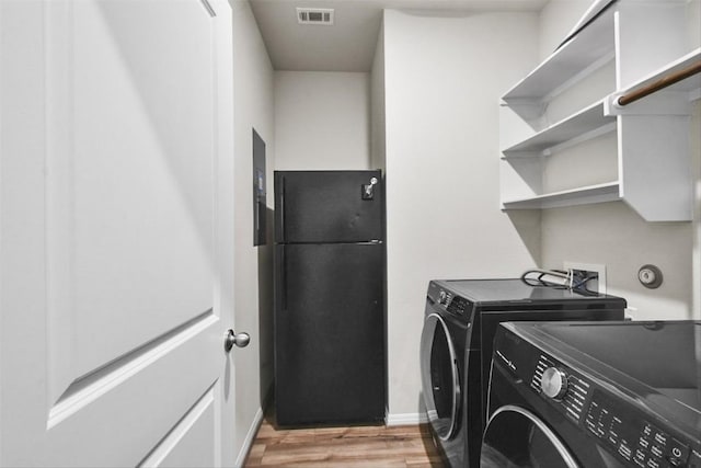 801 Russet Rock Dr Unit 6, Manchaca, TX 78748 - washroom with independent washer and dryer, light wood finished floors, and baseboards