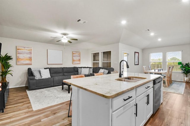 801 Russet Rock Dr Unit 6, Manchaca, TX 78748 - kitchen with a sink, stainless steel dishwasher, an island with sink, light wood-style floors, and recessed lighting