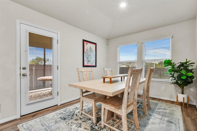 801 Russet Rock Dr Unit 6, Manchaca, TX 78748 - dining space with wood finished floors, vaulted ceiling, and baseboards