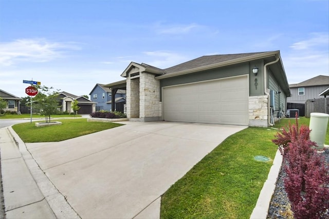 801 Russet Rock Dr Unit 6, Manchaca, TX 78748 - view of front of house with stone siding, driveway, an attached garage, a front yard, and central AC