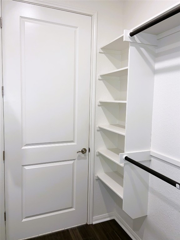 19024 Fernando Trl, Austin, TX 78738 - walk in closet with dark wood-style flooring