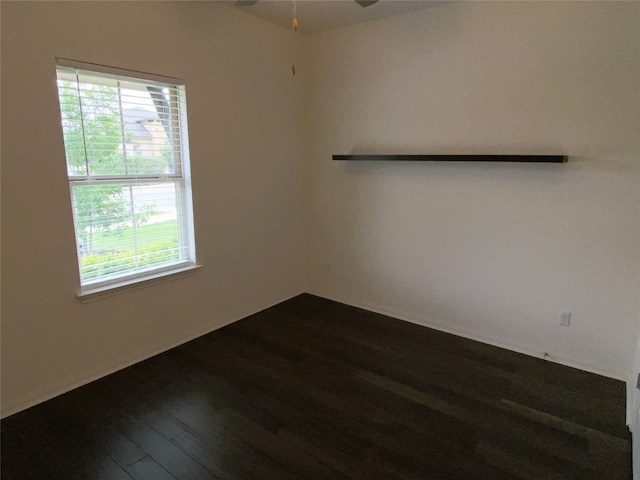 19024 Fernando Trl, Austin, TX 78738 - empty room featuring dark wood-style floors, plenty of natural light, and a ceiling fan