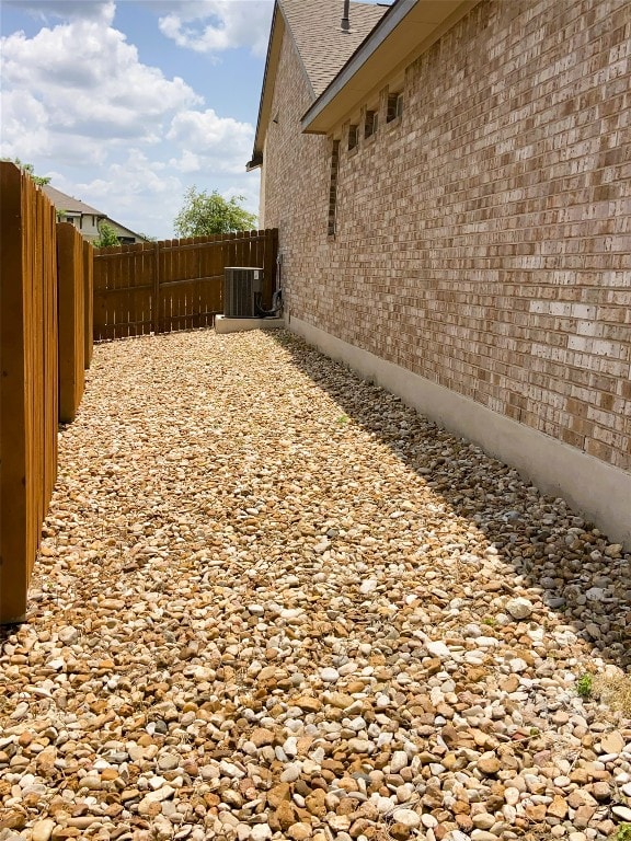 19024 Fernando Trl, Austin, TX 78738 - view of yard featuring central AC unit