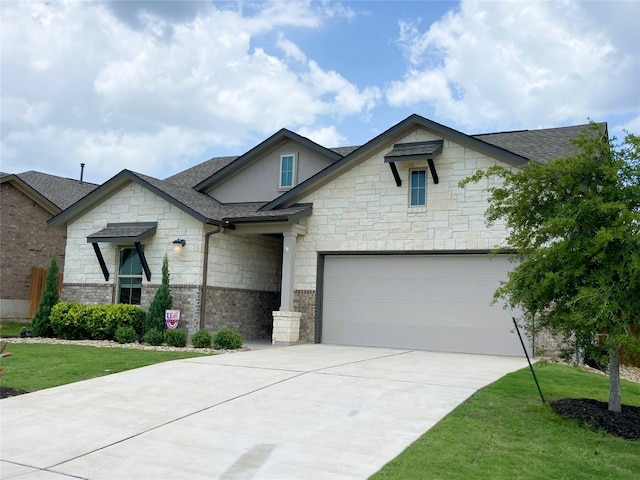 19024 Fernando Trl, Austin, TX 78738 - french provincial home with stone siding, a shingled roof, driveway, and a front yard