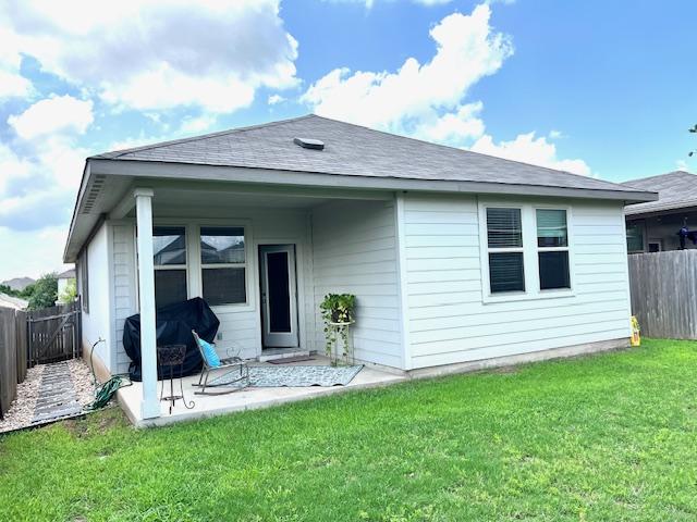 232 Serpens St, Georgetown, TX 78628 - back of house with a fenced backyard, a patio, and a shingled roof