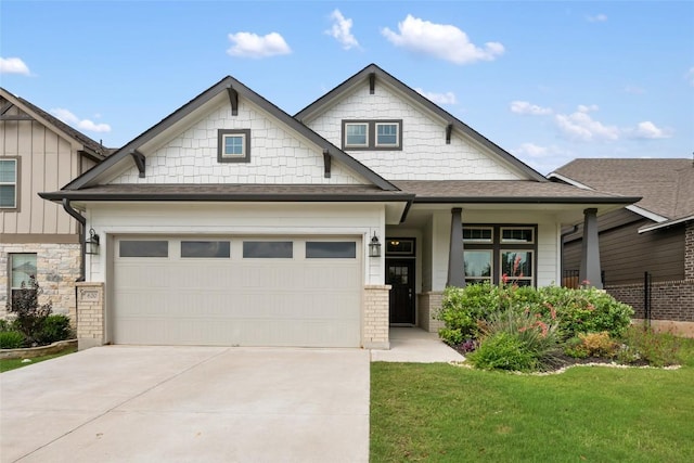 620 Saturnia Dr, Georgetown, TX 78628 - craftsman-style home featuring concrete driveway, an attached garage, roof with shingles, a front lawn, and board and batten siding