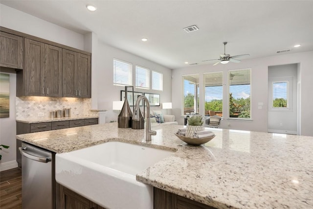 620 Saturnia Dr, Georgetown, TX 78628 - kitchen with decorative backsplash, a ceiling fan, dark wood-type flooring, plenty of natural light, and recessed lighting