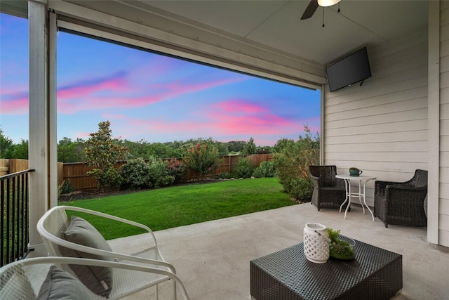 620 Saturnia Dr, Georgetown, TX 78628 - patio terrace at dusk with ceiling fan, a fenced backyard, and a patio area
