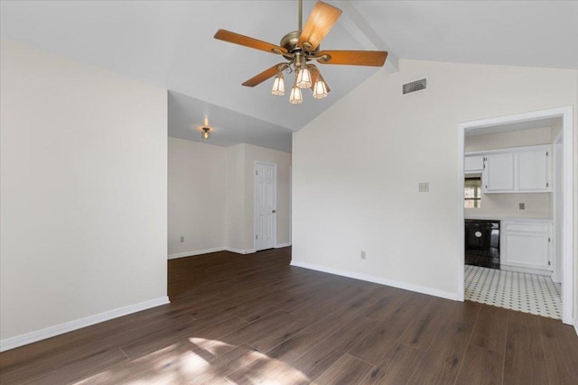 910 Garwood St, Smithville, TX 78957 - unfurnished living room with dark wood-style floors, beam ceiling, ceiling fan, and high vaulted ceiling