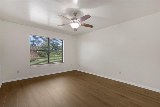 910 Garwood St, Smithville, TX 78957 - spare room featuring dark wood-style floors and ceiling fan