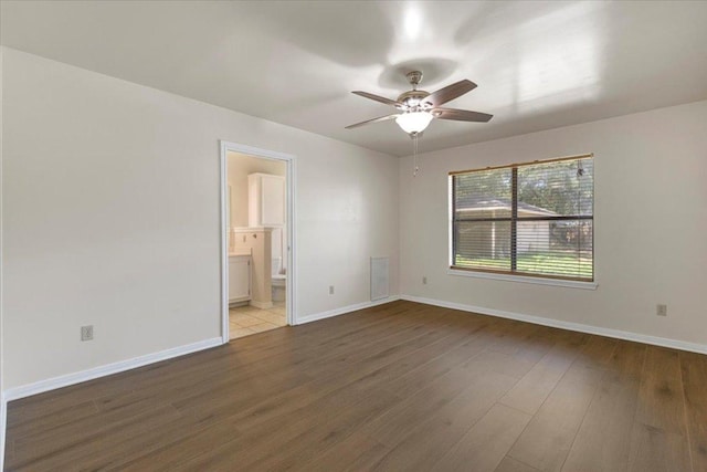 910 Garwood St, Smithville, TX 78957 - unfurnished room featuring a ceiling fan and wood finished floors