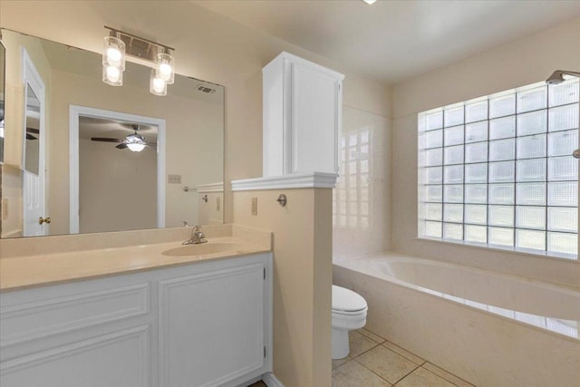 910 Garwood St, Smithville, TX 78957 - bathroom featuring a bath, tile patterned floors, vanity, and a ceiling fan