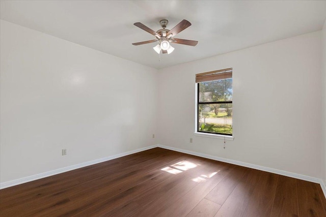 910 Garwood St, Smithville, TX 78957 - unfurnished room with dark wood-style floors and a ceiling fan