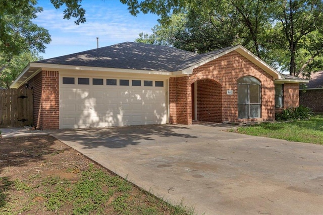 910 Garwood St, Smithville, TX 78957 - single story home with brick siding, an attached garage, and concrete driveway