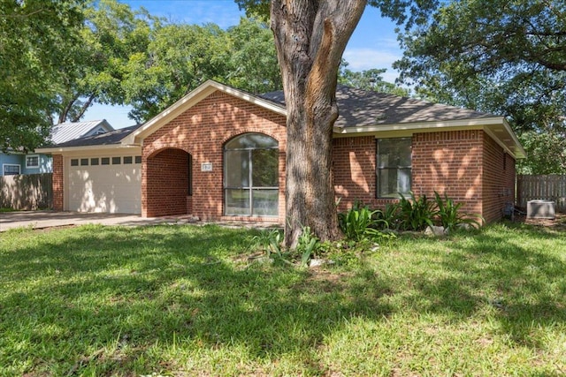 910 Garwood St, Smithville, TX 78957 - single story home featuring brick siding, an attached garage, and driveway