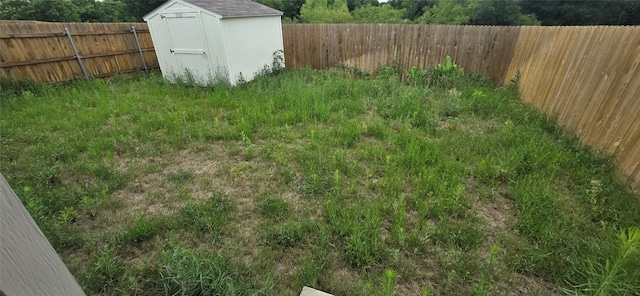 12008 Roving Pass, Elgin, TX 78621 - fenced backyard with a storage shed