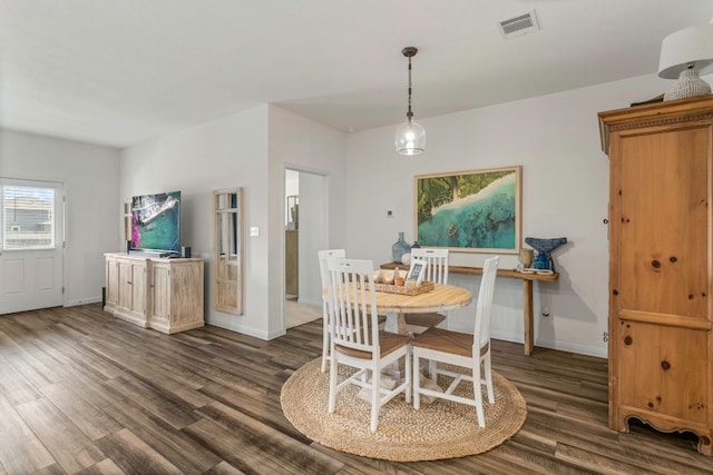 121 Rubrum Rd, Kyle, TX 78640 - dining space with dark wood finished floors and baseboards